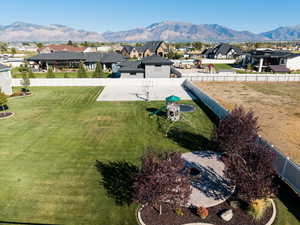 Aerial view of residential area featuring a mountainous background