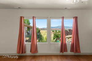 Doorway with wood finished floors and a mountain view
