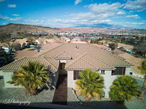 Aerial view of residential area featuring a mountainous background