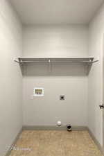 Washroom featuring washer hookup and electric dryer hookup