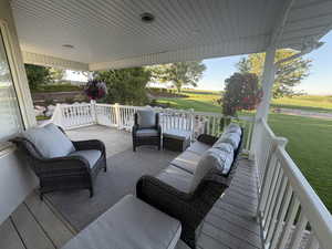 Deck with outdoor lounge area and a yard