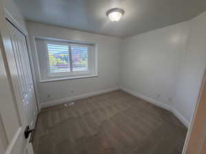 Unfurnished bedroom with carpet floors and a closet