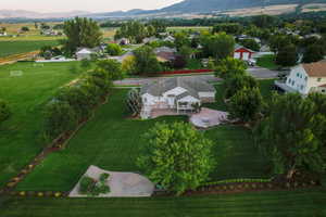 Aerial view of property and surrounding area featuring mountains