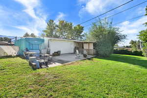 Back of property featuring a patio and brick siding