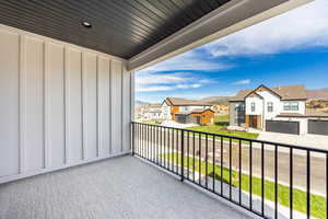 Balcony featuring a residential view and a mountain view