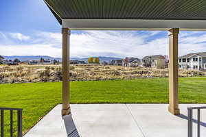 View of patio / terrace featuring a mountain view and a residential view