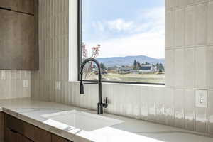 Kitchen featuring a mountain view and modern cabinets