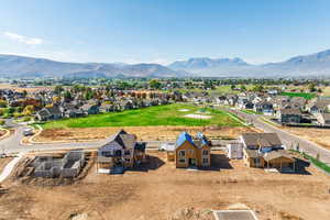 Aerial view of residential area featuring a mountainous background