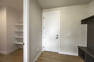Mudroom featuring light wood-style floors
