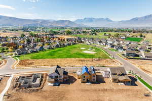 Aerial perspective of suburban area with a mountain backdrop