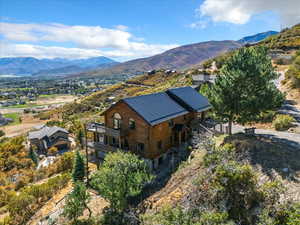 View from above of property with a mountainous background
