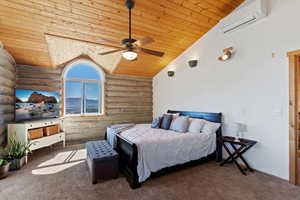 Carpeted bedroom with log walls, wood ceiling, lofted ceiling, a wall unit AC, and a ceiling fan