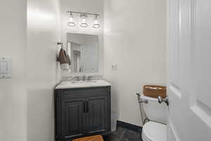 Guest Bathroom with vanity and toilet