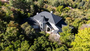 View of subject property featuring private wooded area