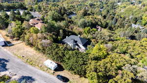 Aerial view of a property & wooded area