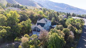 Aerial view of property and surrounding area with mountains