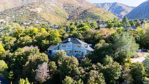 View of subject property featuring a mountainous background