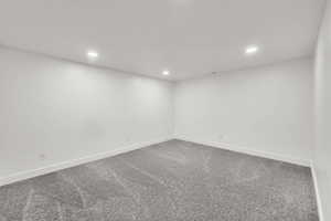 Basement featuring recessed lighting and carpet floors