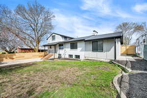 Rear view of house with a chimney