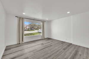 Spare room with light wood-style flooring and recessed lighting