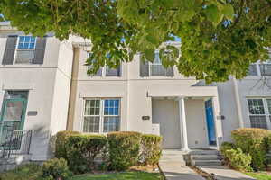 Property entrance with stucco siding