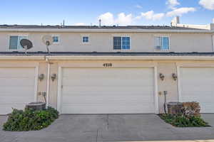 Garage with concrete driveway