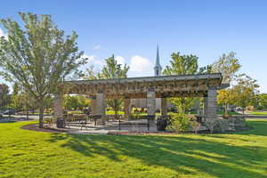 View of community featuring a yard and a patio
