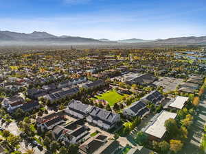 Aerial view of property's location with a mountainous background and nearby suburban area