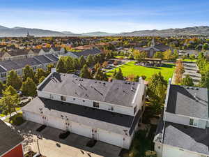 Aerial perspective of suburban area with a mountainous background