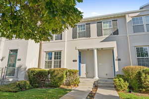 Property entrance with stucco siding