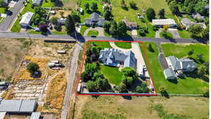 Aerial perspective of suburban area featuring property parcel outlined