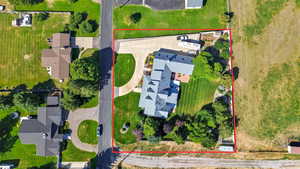 Aerial view of property and surrounding area featuring property parcel outlined