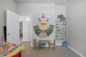 Bedroom Playroom featuring light carpet