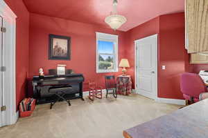 Executive Office space featuring light colored carpet and baseboards
