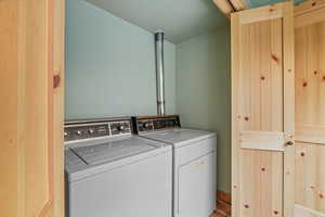 Washroom with washing machine and clothes dryer