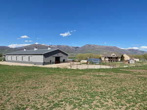 View of mountain backdrop with rural landscape