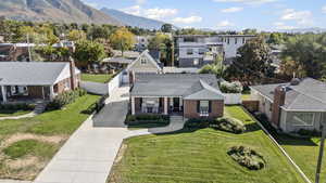 Aerial view of residential area featuring a mountainous background