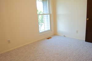 Spare room featuring carpet floors