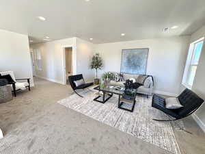 Living room featuring recessed lighting and carpet flooring