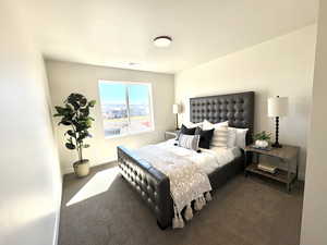 Bedroom with carpet flooring and baseboards