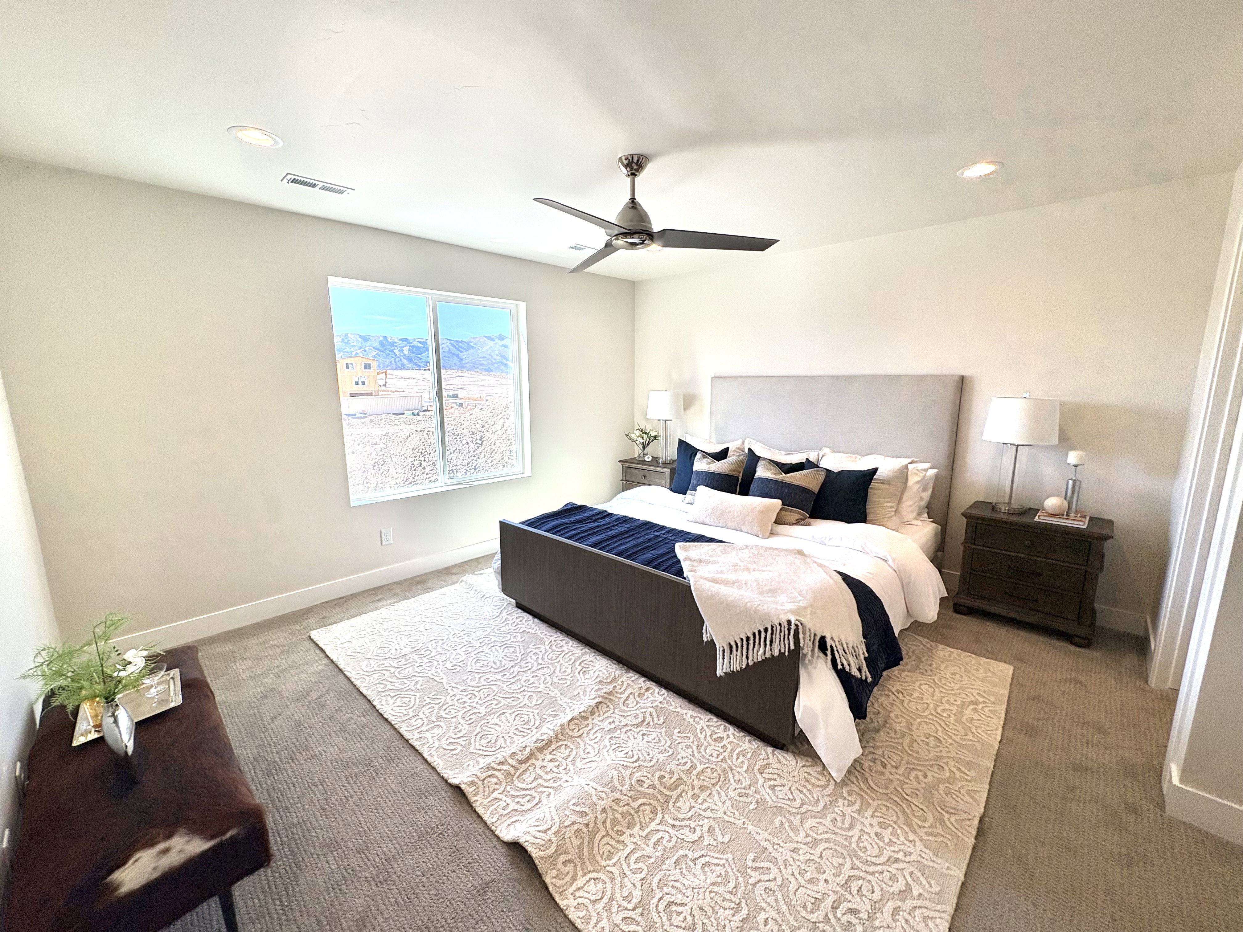 Bedroom with light carpet, recessed lighting, and ceiling fan