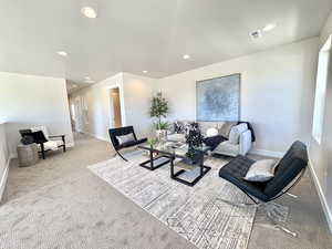 Living room featuring recessed lighting and light carpet