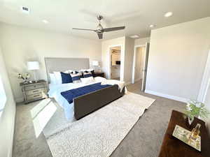 Bedroom with recessed lighting, carpet flooring, ensuite bath, and a ceiling fan