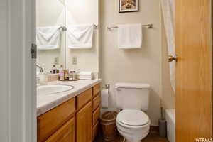 Full bathroom featuring vanity and shower / bathtub combination with curtain