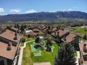 Aerial perspective of suburban area featuring a mountain backdrop