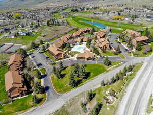Aerial view of residential area featuring a nearby body of water