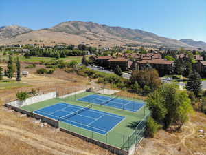 Aerial perspective of suburban area featuring a mountain backdrop