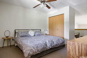 Bedroom with carpet flooring, a closet, and ceiling fan
