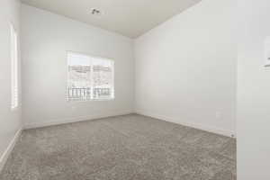 Upstairs bedroom with balcony feature.