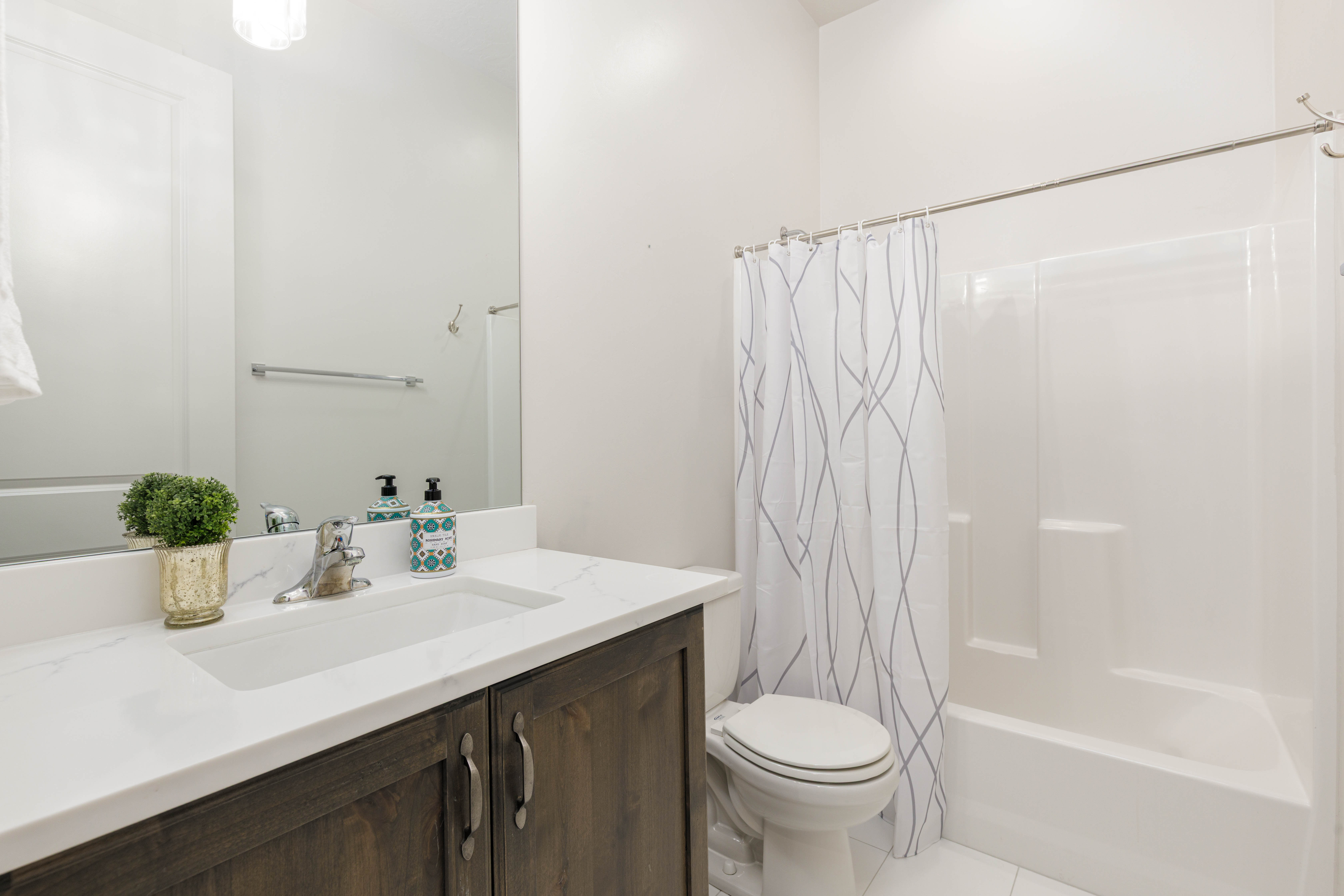 Full bathroom with vanity, tile patterned flooring, and shower / bath combo